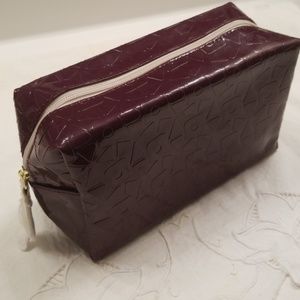 Estee Lauder purple patterned cosmetic bag. NWOT.